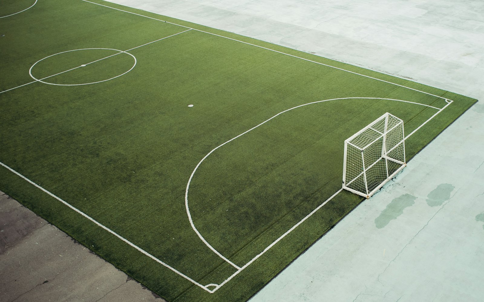 An overhead view of a marked green soccer field and goal at Riverbend Sports Complex.